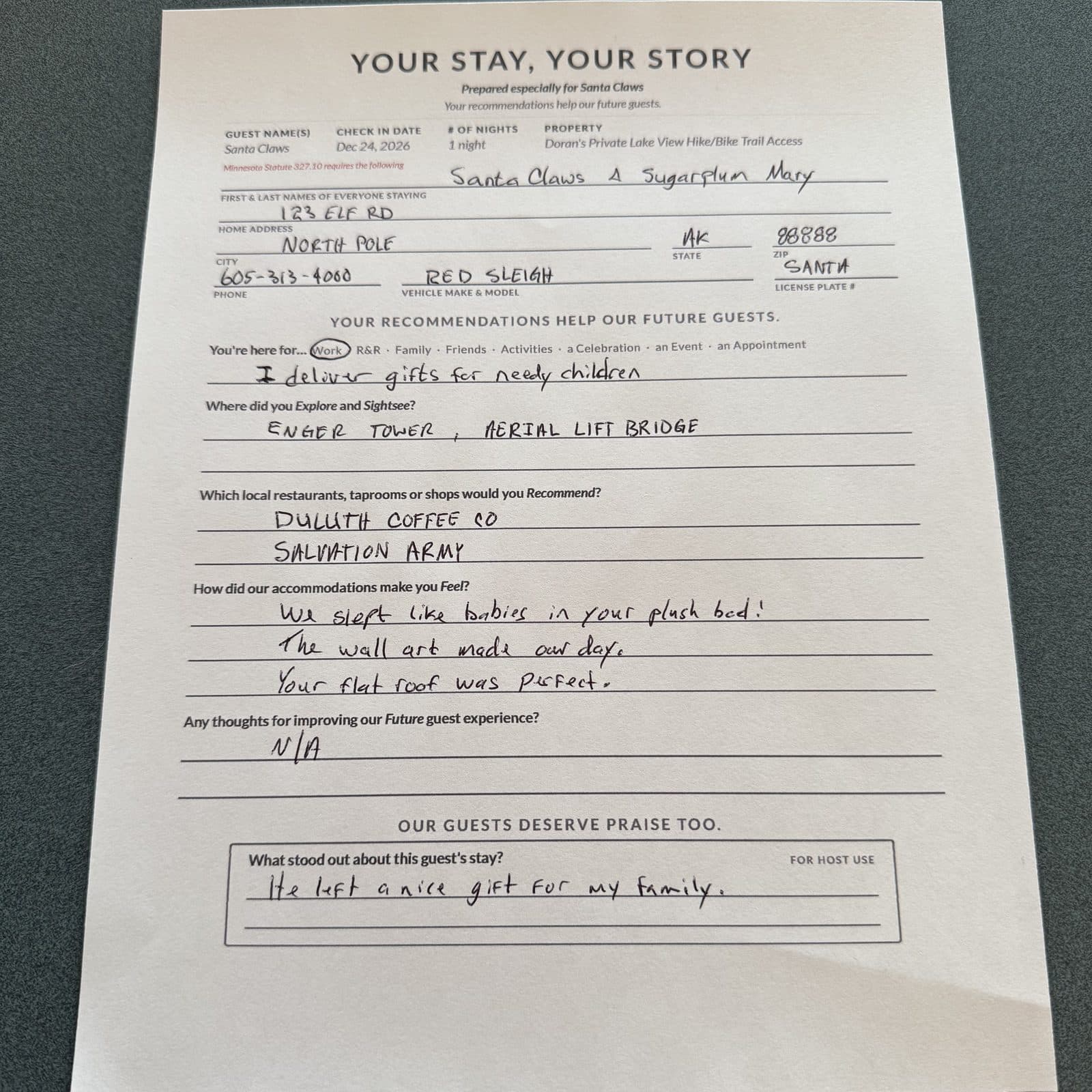 A full-size guest card filled out by hand